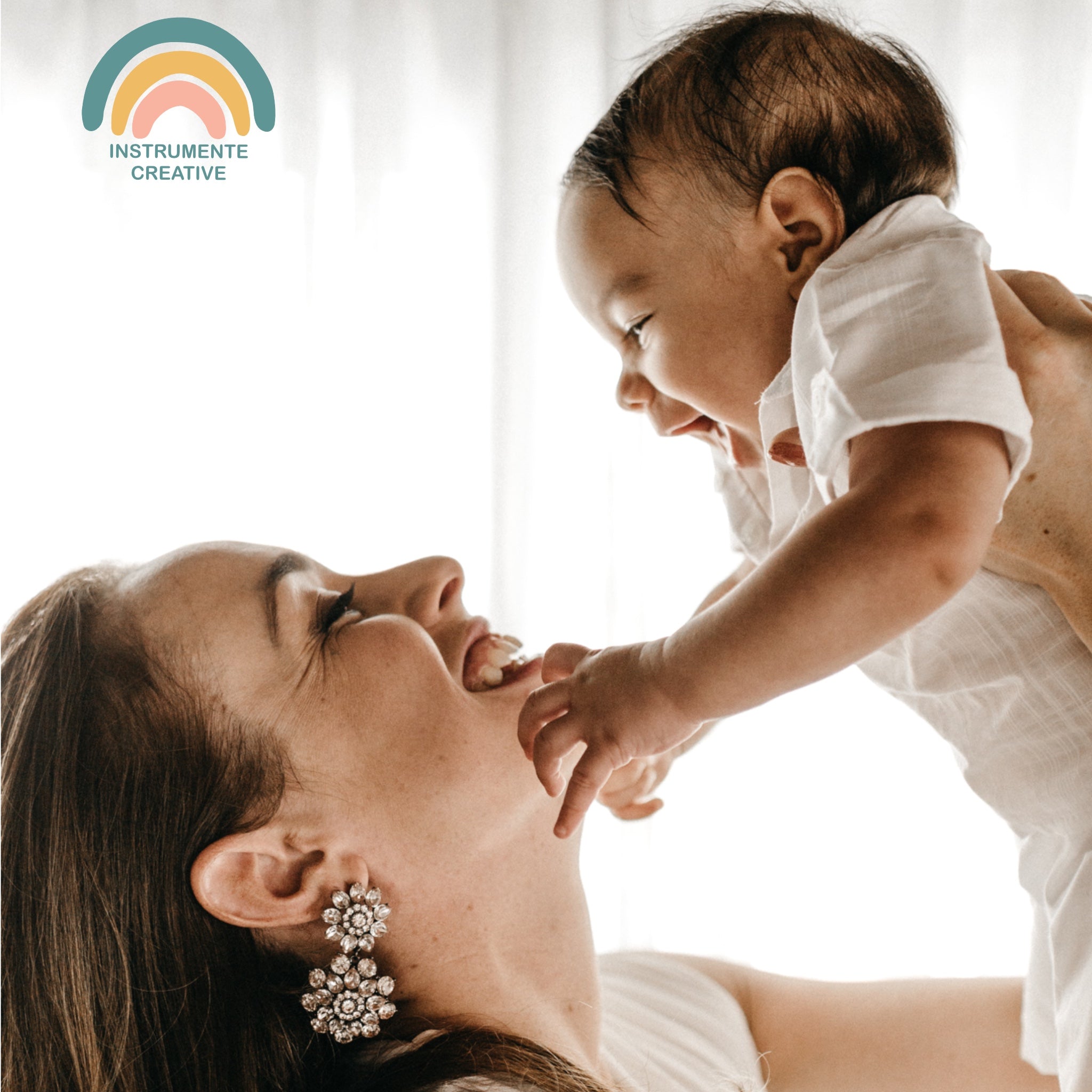 Mother holding a baby smiling 